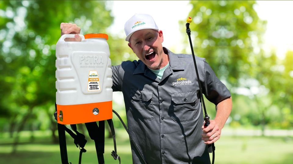 A man happily hodling using PetraTools HD3000 Battery powered backpack sprayer